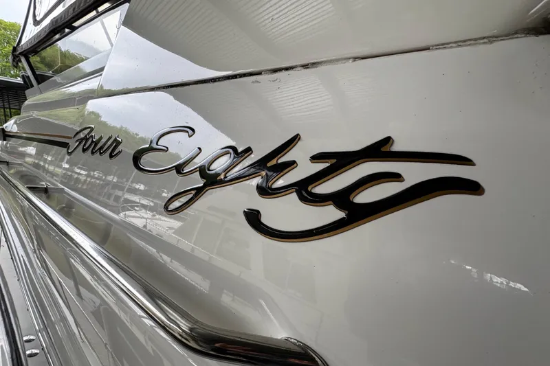 Slide: The Image of Close-up of 1999 Sea Ray 480 Sedan Bridge boat nameplate, 'Four Eighty.' - 11