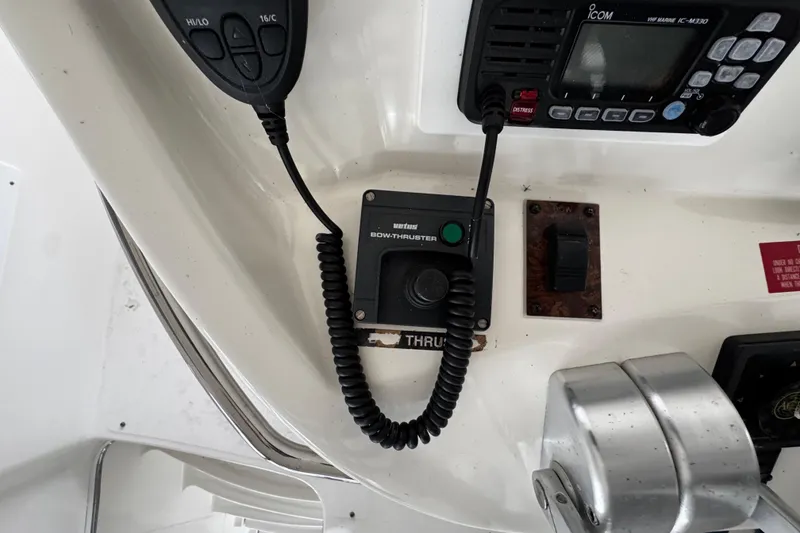 Slide: The Image of Control panel of a 1999 Sea Ray 480 Sedan Bridge with communication and navigation equipment. - 17