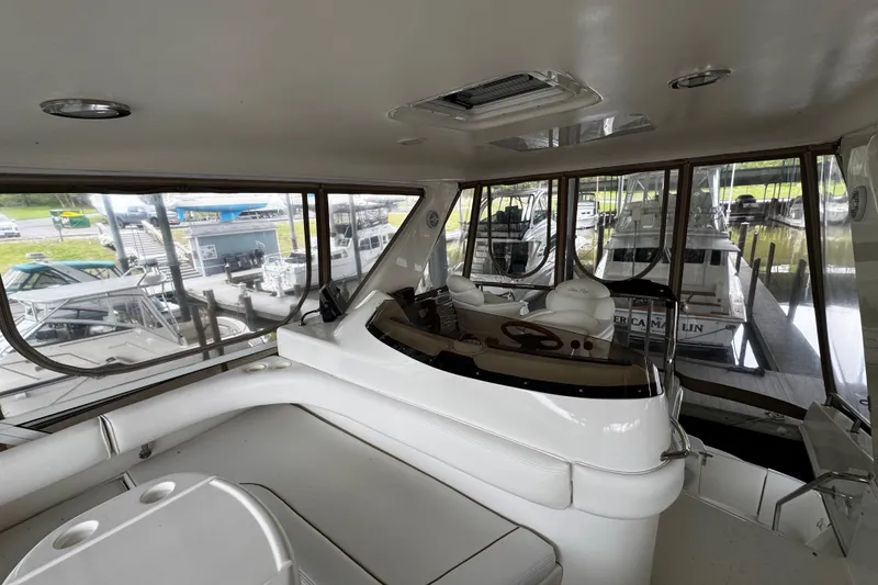 Slide: The Image of Interior view of a 1999 Sea Ray 480 Sedan Bridge yacht at a marina. - 20