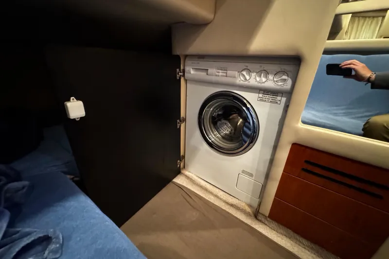 Slide: The Image of Laundry area inside a 1999 Sea Ray 480 Sedan Bridge yacht. - 28