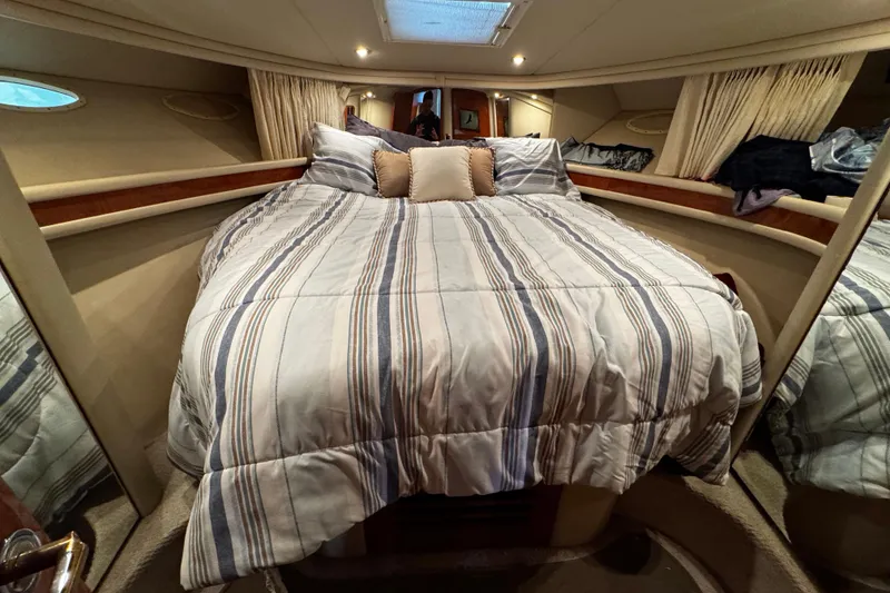 Slide: The Image of Luxurious bedroom interior of 1999 Sea Ray 480 Sedan Bridge yacht. - 31