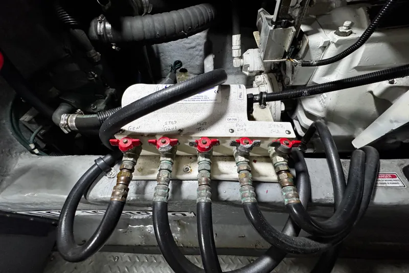 Slide: The Image of Engine compartment of a 1999 Sea Ray 480 Sedan Bridge with hydraulic connections. - 38