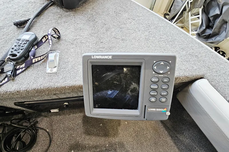 Slide: The Image of Lowrance fish finder on 2011 Alumacraft Trophy 195 boat dashboard. - 15