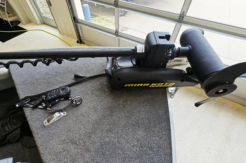 Slide: The Image of Minn Kota trolling motor on 2011 Alumacraft Trophy 195 boat deck. - 16