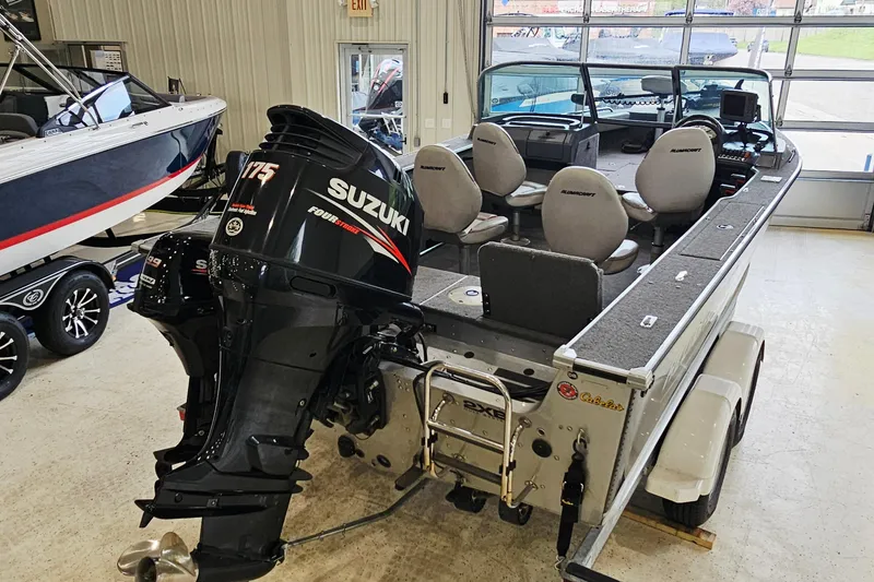 Slide: The Image of 2011 Alumacraft Trophy 195 boat with Suzuki 175 outboard motor in showroom. - 5