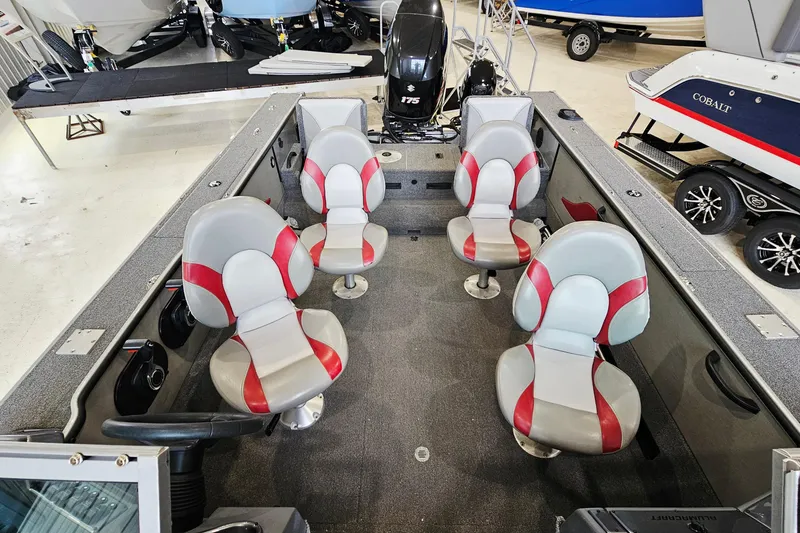 Slide: The Image of 2011 Alumacraft Trophy 195 boat interior with red and gray seating arrangement. - 7