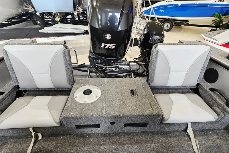 Slide: The Image of 2011 Alumacraft Trophy 195 boat interior with Suzuki 175 engine and seating. - 8
