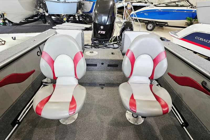 Slide: The Image of 2011 Alumacraft Trophy 195 boat interior with red and gray seating, Suzuki 175 engine. - 9