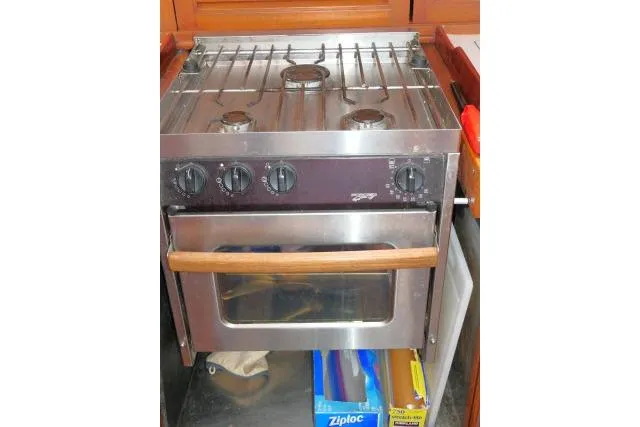 Slide: The Image of Stainless steel stove and oven in 1986 Tayana 52 Center Cockpit yacht kitchen. - 12