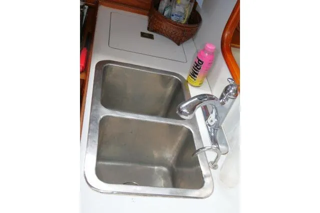 Slide: The Image of Double stainless steel sink in 1986 Tayana 52 Center Cockpit yacht kitchen. - 13