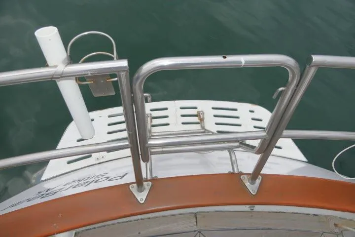 Slide: The Image of Stainless steel railing on 1986 Tayana 52 Center Cockpit yacht's stern deck. - 46