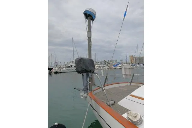 Slide: The Image of 1986 Tayana 52 Center Cockpit sailboat docked in a marina, overcast sky. - 47