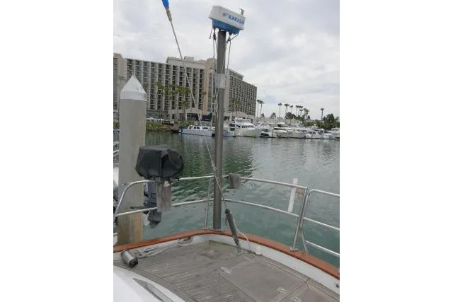Slide: The Image of Sailboat docked in marina, Tayana 52 Center Cockpit, 1986 model, with waterfront view. - 48