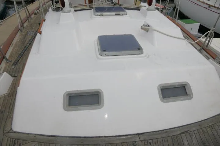 Slide: The Image of 1986 Tayana 52 Center Cockpit yacht deck with hatches and railing. - 50