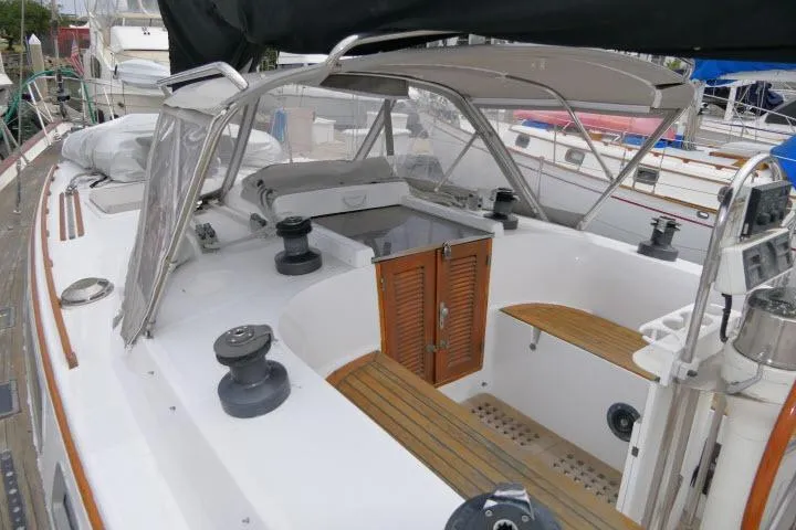 Slide: The Image of 1986 Tayana 52 Center Cockpit sailboat with spacious deck and wooden accents. - 51
