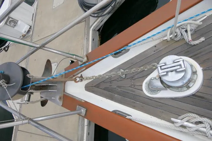 Slide: The Image of Deck view of 1986 Tayana 52 Center Cockpit sailboat with anchor chain and winch. - 57