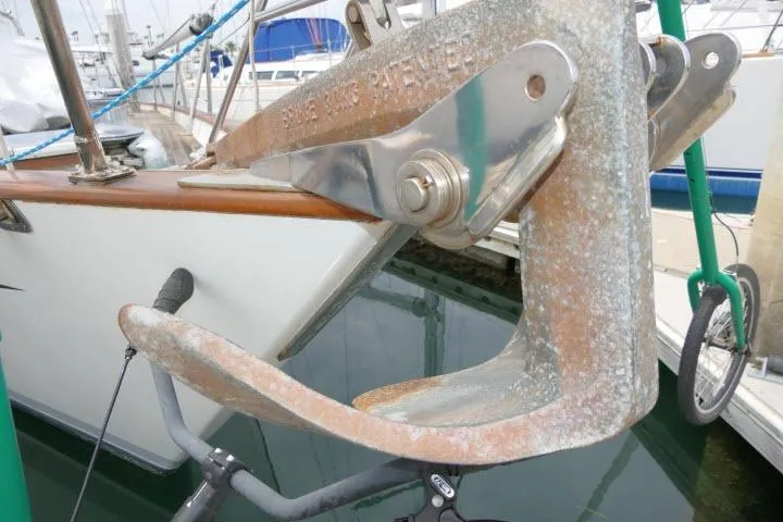 Slide: The Image of Anchor on 1986 Tayana 52 Center Cockpit sailboat, docked in marina. - 59