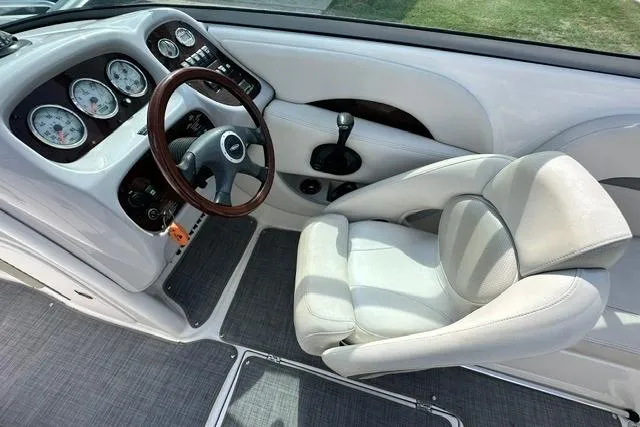 Slide: The Image of 2006 Chaparral 236 SSi boat cockpit with steering wheel and gauges. - 15