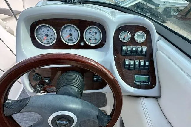 Slide: The Image of Dashboard of a 2006 Chaparral 236 SSi boat with gauges and controls. - 16
