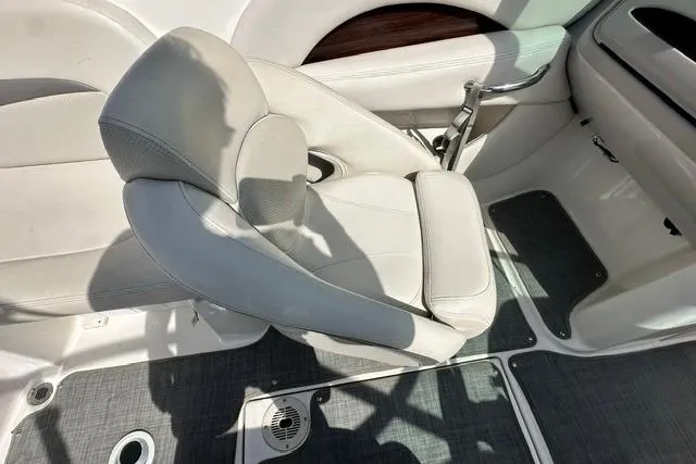 Slide: The Image of 2006 Chaparral 236 SSi boat interior with white seating and gray flooring. - 18