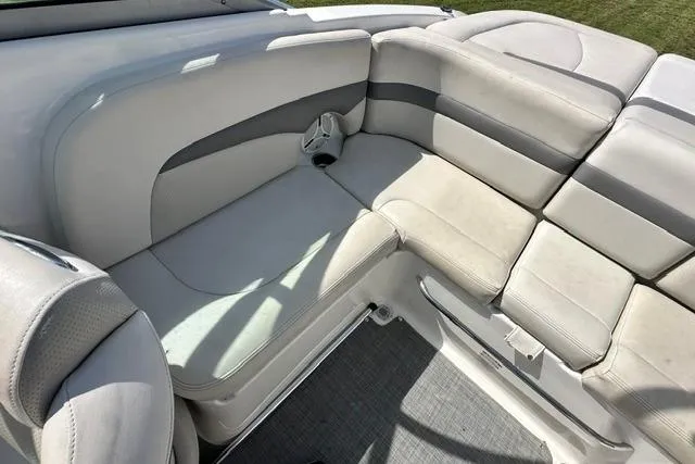 Slide: The Image of 2006 Chaparral 236 SSi boat interior with cushioned seating and cup holder. - 20