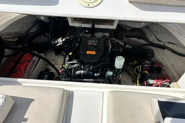 Slide: The Image of Engine compartment of a 2006 Chaparral 236 SSi boat, showcasing mechanical components. - 24