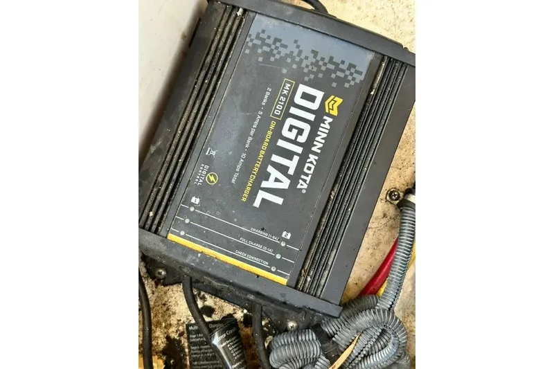 Slide: The Image of Minn Kota MK 210D onboard battery charger in a 2006 Chaparral 236 SSi boat. - 26