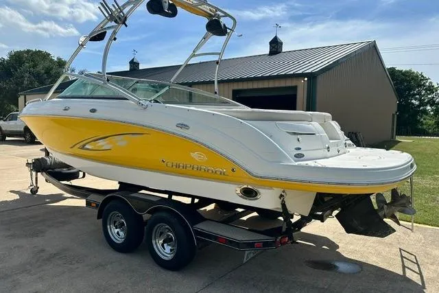 Slide: The Image of 2006 Chaparral 236 SSi boat with yellow and white exterior on a trailer. - 4