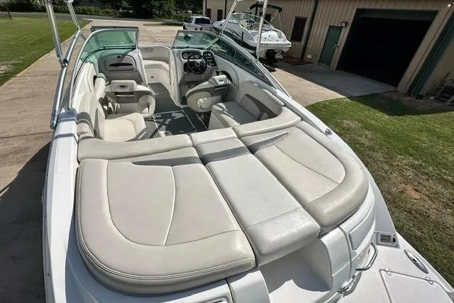 Slide: The Image of 2006 Chaparral 236 SSi boat interior with spacious seating and modern dashboard. - 8