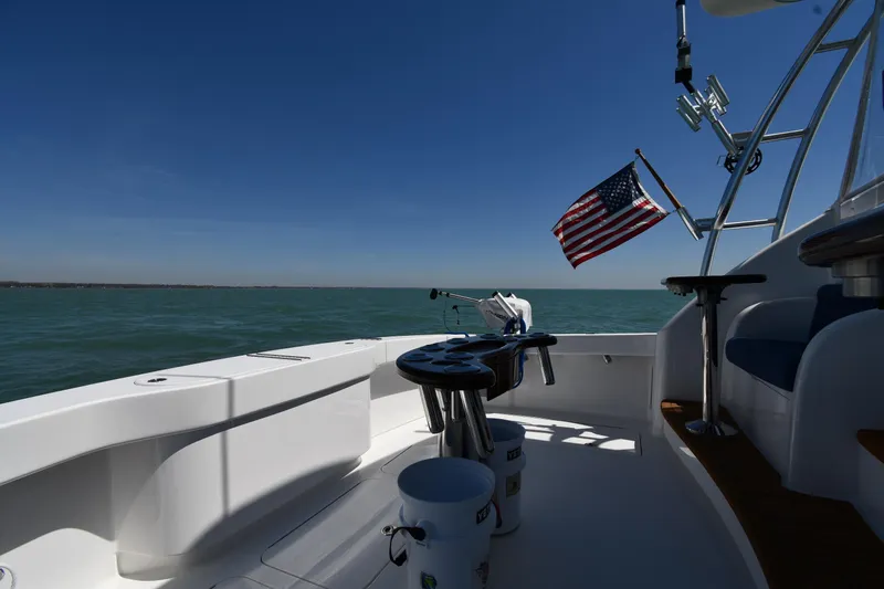 Slide: The Image of 2012 Viking 42 Open yacht deck with American flag, ocean view. - 11