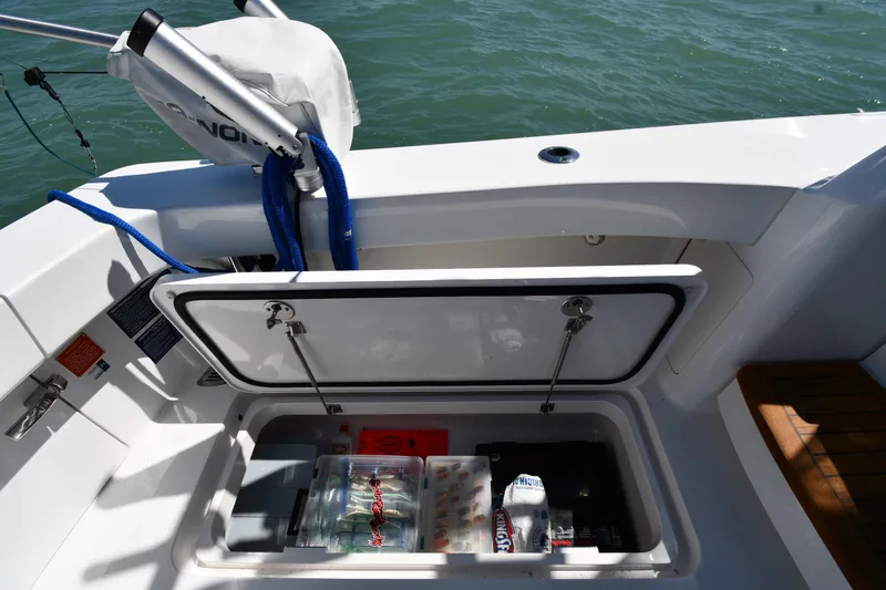 Slide: The Image of Storage compartment on a 2012 Viking 42 Open boat, containing fishing gear and supplies. - 15
