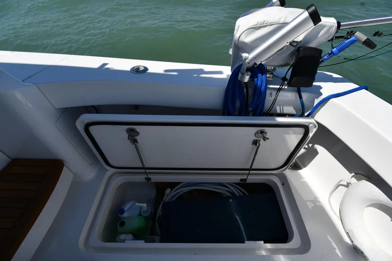 Slide: The Image of Storage compartment on a 2012 Viking 42 Open boat, featuring marine equipment and supplies. - 16