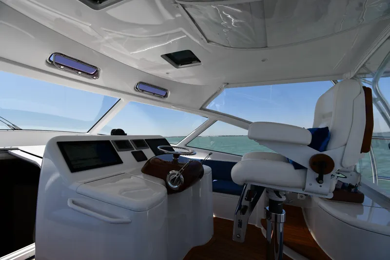 Slide: The Image of Interior of 2012 Viking 42 Open yacht with helm and captain's chair. - 18