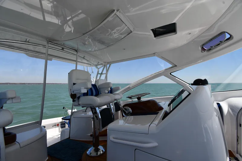 Slide: The Image of Interior view of 2012 Viking 42 Open yacht helm with ocean backdrop. - 20