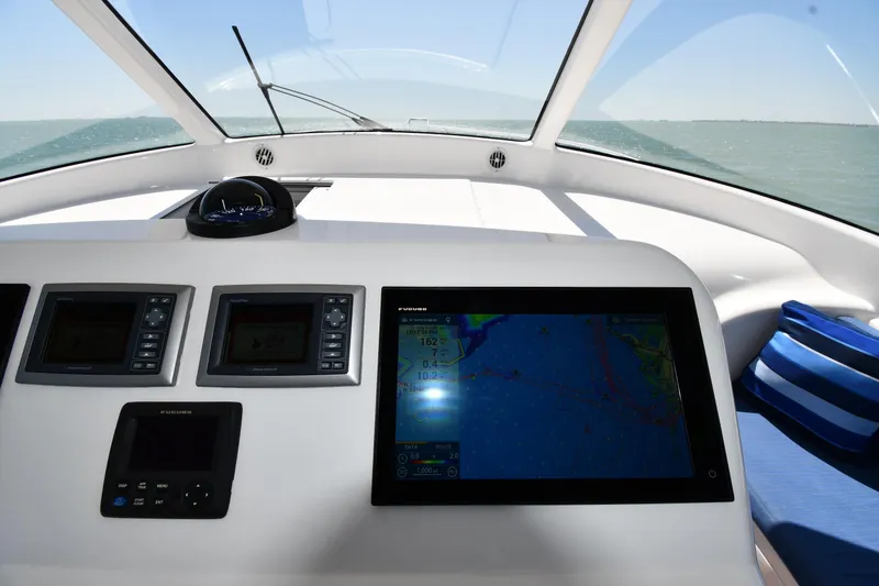 Slide: The Image of Helm of 2012 Viking 42 Open yacht with navigation screens and compass. - 25