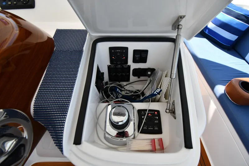 Slide: The Image of Storage compartment on a 2012 Viking 42 Open boat with control panels and accessories. - 28