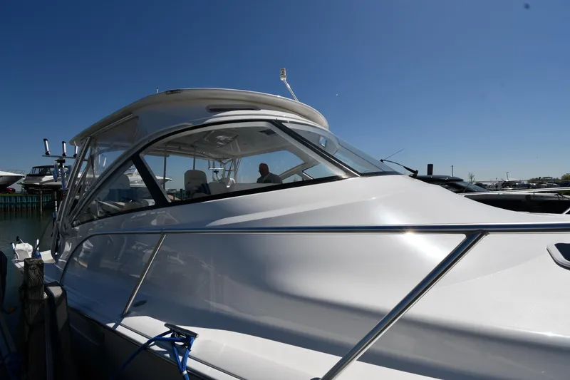Slide: The Image of 2012 Viking 42 Open yacht docked under clear blue sky. - 3