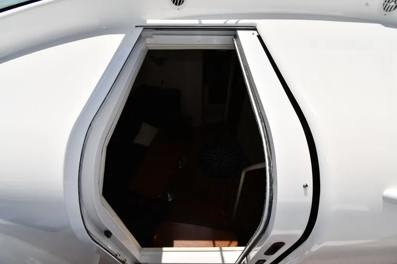 Slide: The Image of Open cabin door of 2012 Viking 42 Open yacht, showcasing interior entry. - 31