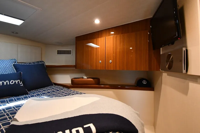 Slide: The Image of Luxurious cabin interior of 2012 Viking 42 Open yacht with cozy bedding and wooden cabinetry. - 34