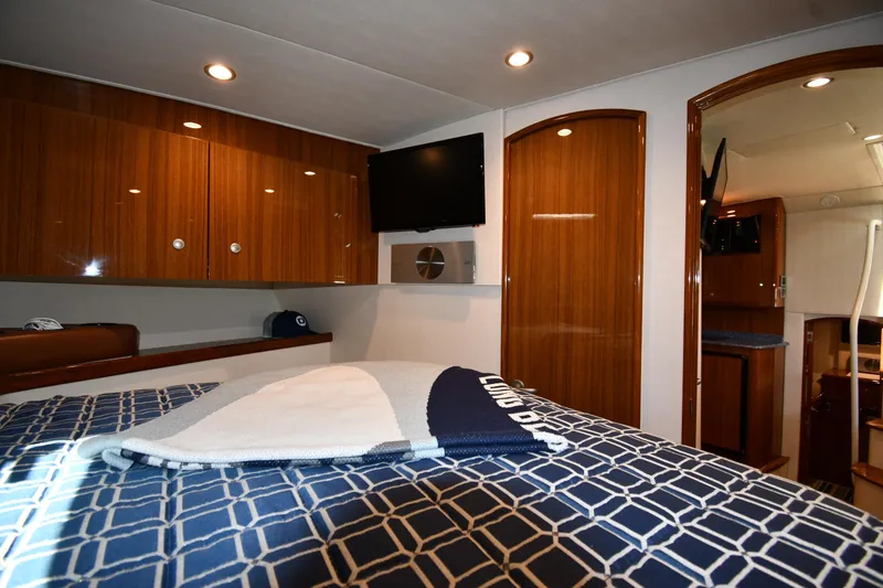 Slide: The Image of Luxurious interior of 2012 Viking 42 Open yacht with wood finishes and modern amenities. - 37