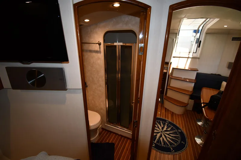 Slide: The Image of Interior of 2012 Viking 42 Open yacht featuring bathroom, stairs, and seating area. - 39