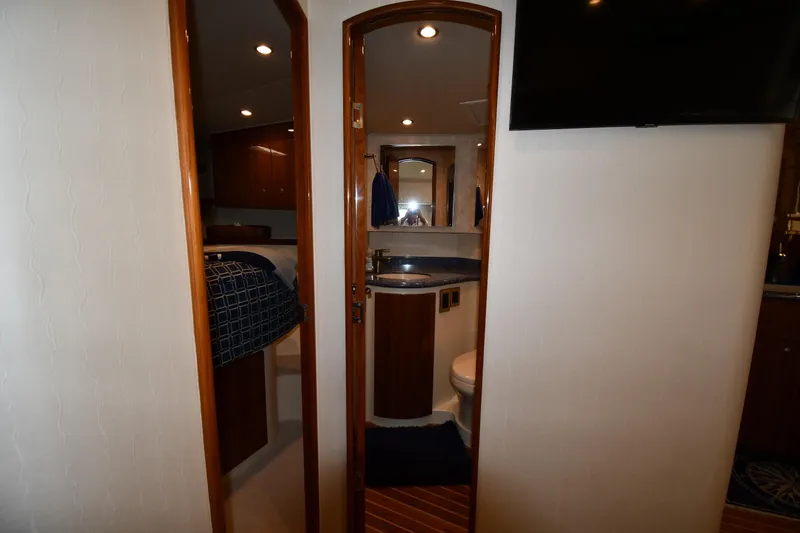 Slide: The Image of Interior of 2012 Viking 42 Open yacht showing bathroom and bedroom. - 41