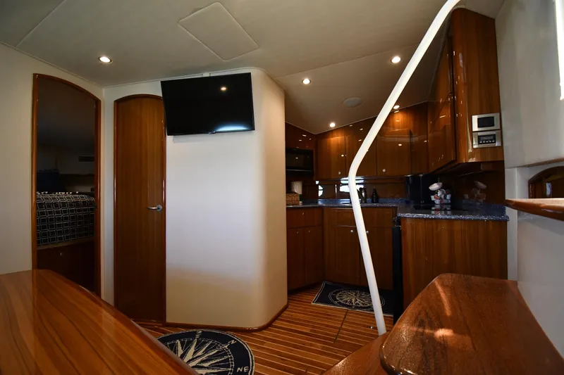 Slide: The Image of Luxurious interior of 2012 Viking 42 Open yacht with modern kitchen and cozy cabin. - 46
