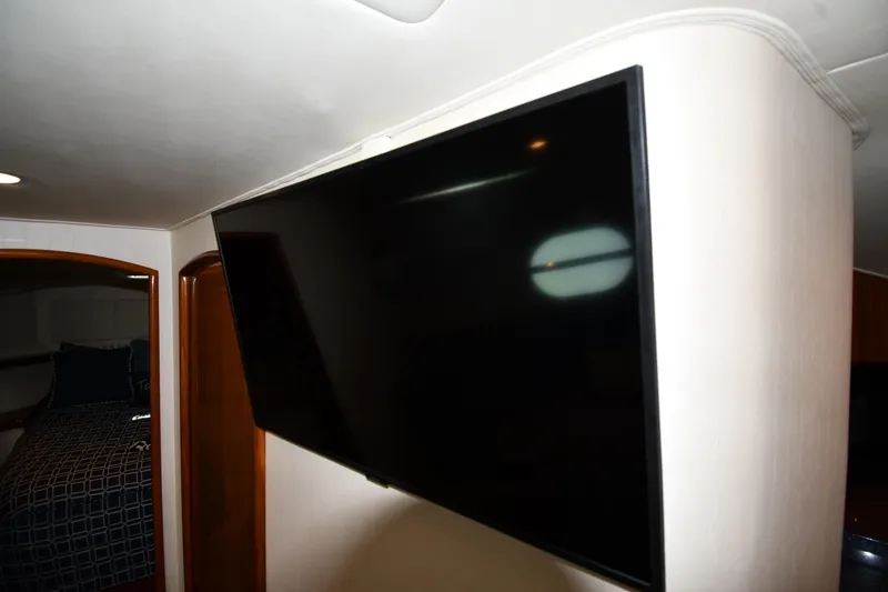Slide: The Image of Flat-screen TV in 2012 Viking 42 Open yacht interior. - 59