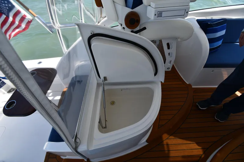 Slide: The Image of 2012 Viking 42 Open yacht interior with open storage compartment and wooden deck. - 60