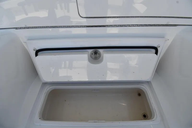 Slide: The Image of Storage compartment on a 2012 Viking 42 Open boat, featuring a secure latch. - 61