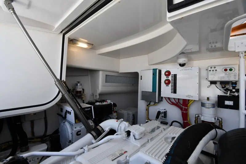 Slide: The Image of Engine room of 2012 Viking 42 Open yacht, featuring control panels and equipment. - 69
