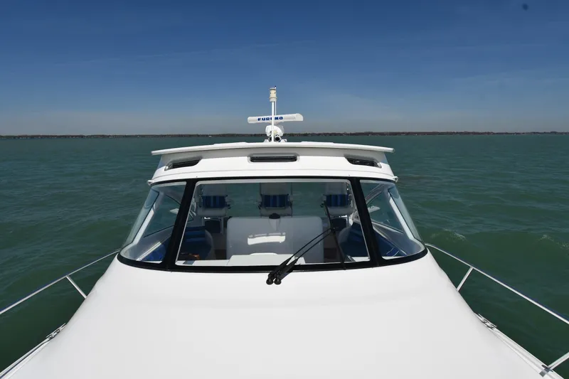 Slide: The Image of 2012 Viking 42 Open yacht on calm sea under clear blue sky. - 7