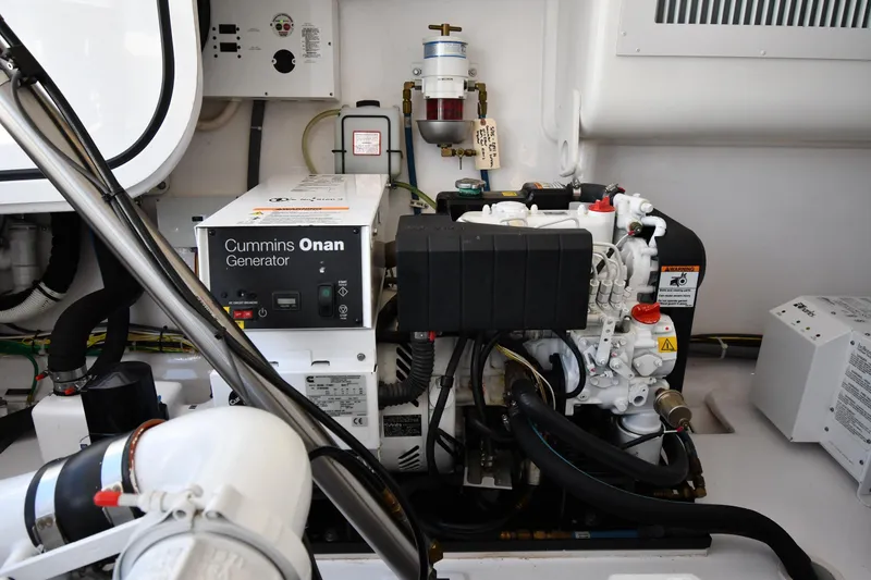Slide: The Image of Engine room of 2012 Viking 42 Open with Cummins Onan generator. - 71