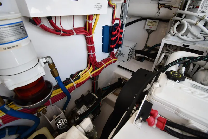 Slide: The Image of Engine room of 2012 Viking 42 Open boat with wiring and components. - 73